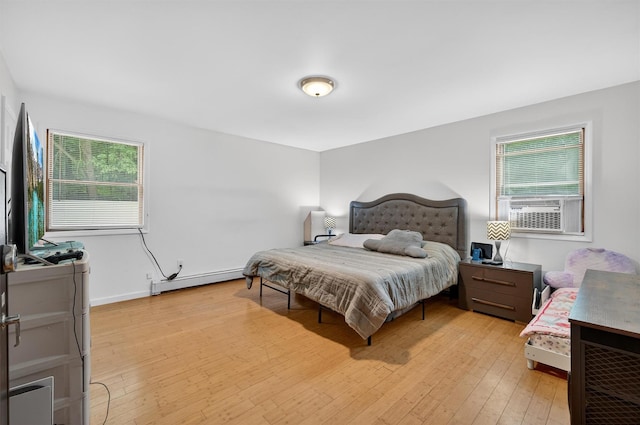 411 Fair Oaks Rd, Middletown, NY 10940 - bedroom with a baseboard radiator, light wood-style floors, and cooling unit