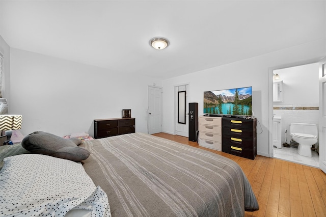 411 Fair Oaks Rd, Middletown, NY 10940 - bedroom with light wood finished floors and ensuite bathroom