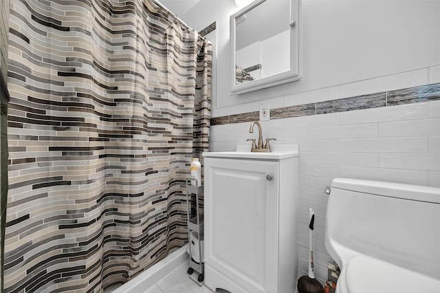 411 Fair Oaks Rd, Middletown, NY 10940 - full bathroom featuring tile walls, vanity, a shower with shower curtain, and wainscoting