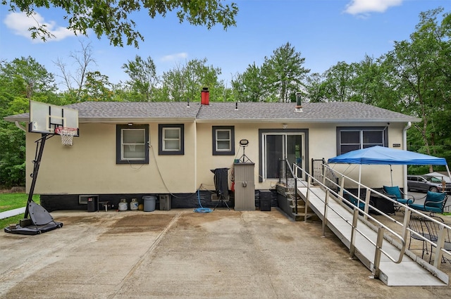411 Fair Oaks Rd, Middletown, NY 10940 - back of house with a shingled roof, a patio area, stucco siding, and entry steps