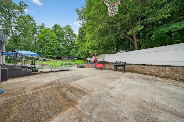 411 Fair Oaks Rd, Middletown, NY 10940 - view of patio with a trampoline, view of scattered trees, and grilling area