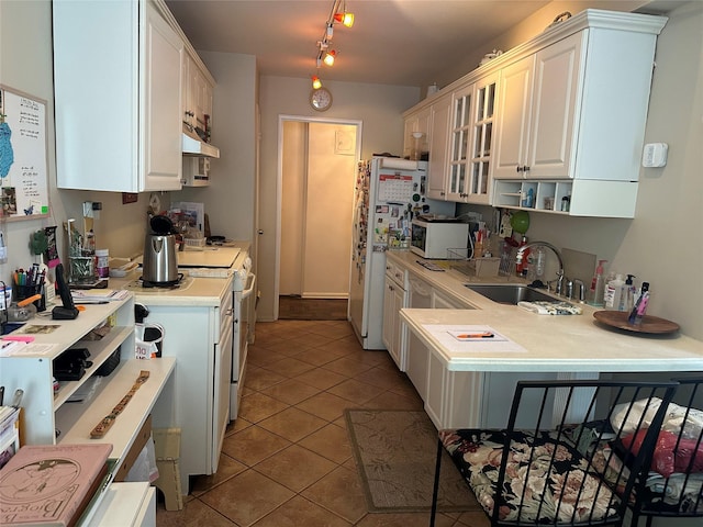 1835 Corporal Kennedy St Unit 1F, Bayside, NY 11360 - kitchen with white appliances, light countertops, tile patterned flooring, glass insert cabinets, and range hood