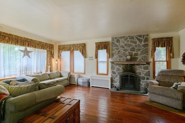 445 Wellington Rd, Mineola, NY 11501 - living room featuring radiator heating unit, healthy amount of natural light, and hardwood / wood-style floors