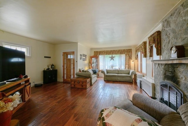 445 Wellington Rd, Mineola, NY 11501 - living area with dark wood finished floors and a stone fireplace