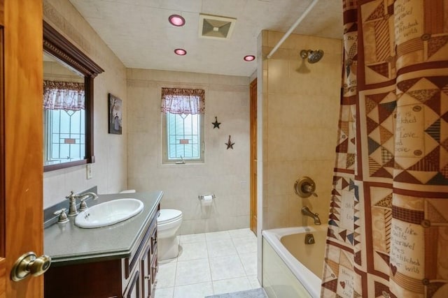 445 Wellington Rd, Mineola, NY 11501 - bathroom featuring vanity, shower / tub combo, tile patterned floors, healthy amount of natural light, and tile walls