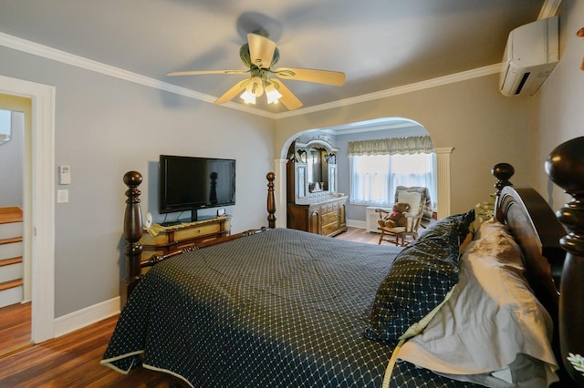 445 Wellington Rd, Mineola, NY 11501 - bedroom with an AC wall unit, wood finished floors, crown molding, arched walkways, and a ceiling fan