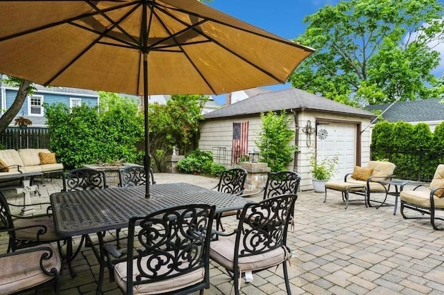 445 Wellington Rd, Mineola, NY 11501 - view of patio / terrace with an outbuilding and outdoor dining area
