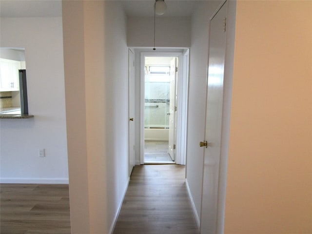 324 Post Ave Apt 8-J, Westbury, NY 11590 - hall with dark wood-style floors and baseboards