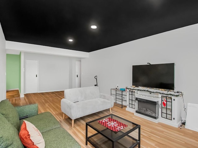75 W 238th St Unit 3H, Bronx, NY 10463 - living area featuring light wood-style flooring, a fireplace, and recessed lighting