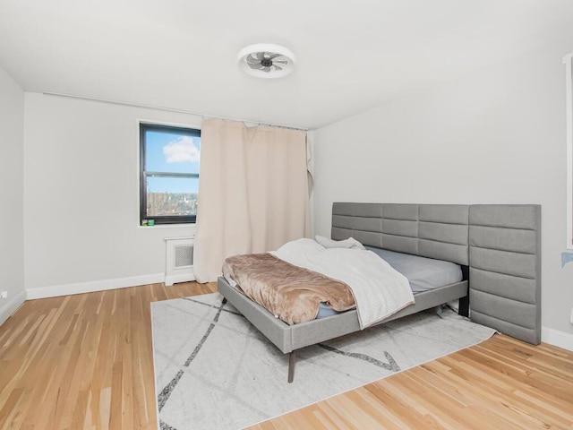 75 W 238th St Unit 3H, Bronx, NY 10463 - bedroom featuring baseboards and wood finished floors