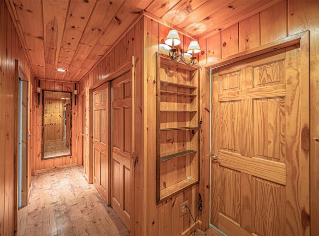444 Buttermilk Falls Rd, Warwick, NY 10990 - hall with wood walls, wooden ceiling, and light wood-type flooring