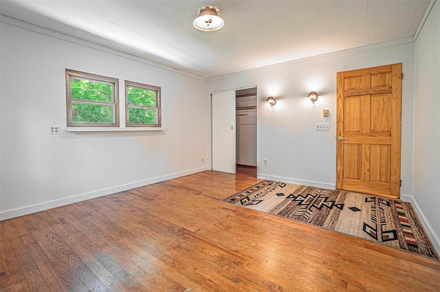444 Buttermilk Falls Rd, Warwick, NY 10990 - unfurnished bedroom featuring hardwood / wood-style flooring, a closet, and crown molding