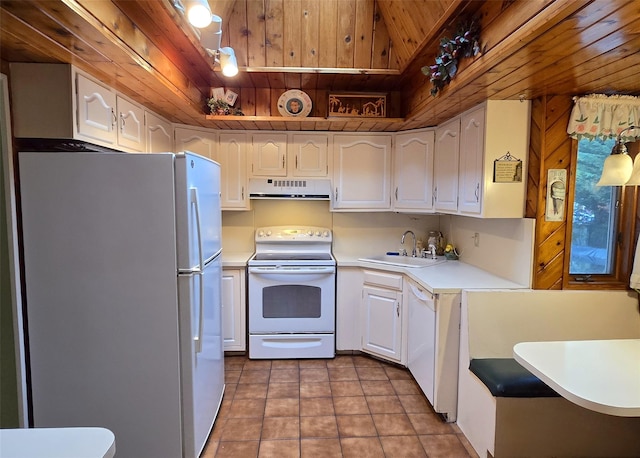 103 Arlington Rd, Lake Ronkonkoma, NY 11779 - kitchen featuring white appliances, under cabinet range hood, wood ceiling, white cabinets, and light countertops