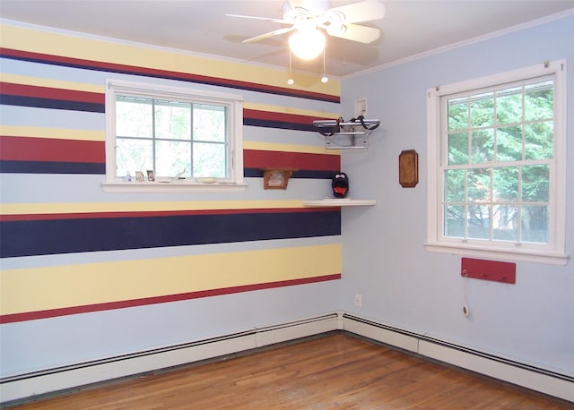 103 Arlington Rd, Lake Ronkonkoma, NY 11779 - unfurnished room featuring a baseboard radiator, wood finished floors, ornamental molding, and ceiling fan
