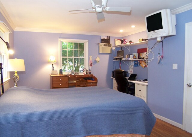 103 Arlington Rd, Lake Ronkonkoma, NY 11779 - bedroom with ornamental molding, a wall mounted air conditioner, wood finished floors, a desk, and ceiling fan