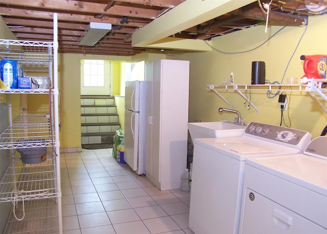 103 Arlington Rd, Lake Ronkonkoma, NY 11779 - laundry area featuring light tile patterned floors and washer and dryer