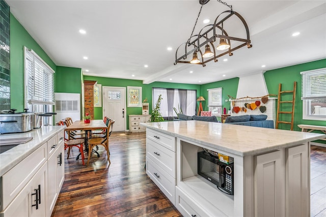1644 Kenneth Ave, Baldwin, NY 11510 - kitchen with recessed lighting, healthy amount of natural light, black microwave, white cabinetry, and dark wood-style floors