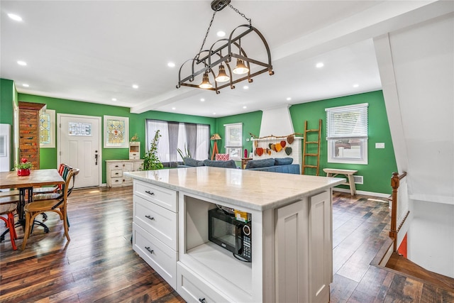1644 Kenneth Ave, Baldwin, NY 11510 - kitchen with black microwave, recessed lighting, beam ceiling, white cabinets, and dark wood finished floors