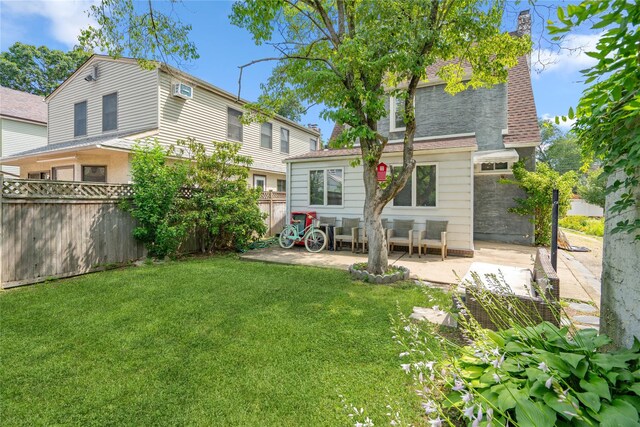 1644 Kenneth Ave, Baldwin, NY 11510 - rear view of property featuring a patio, a fenced backyard, and a chimney