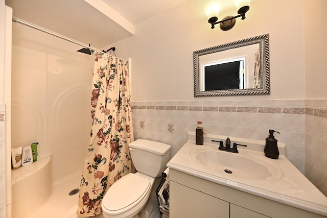 17 E Stemmer Ln, Suffern, NY 10901 - bathroom with tile walls, vanity, a stall shower, and wainscoting