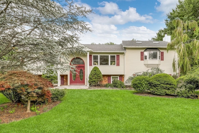 28 Lime Kiln Rd, Suffern, NY 10901 - raised ranch featuring a chimney, a front lawn, and a shingled roof