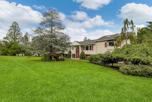 28 Lime Kiln Rd, Suffern, NY 10901 - view of front of house with a front yard and a chimney