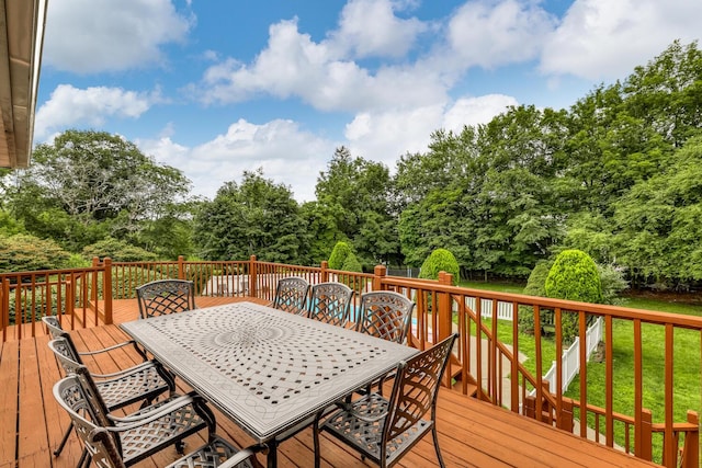 28 Lime Kiln Rd, Suffern, NY 10901 - deck with outdoor dining area, a yard, and view of wooded area