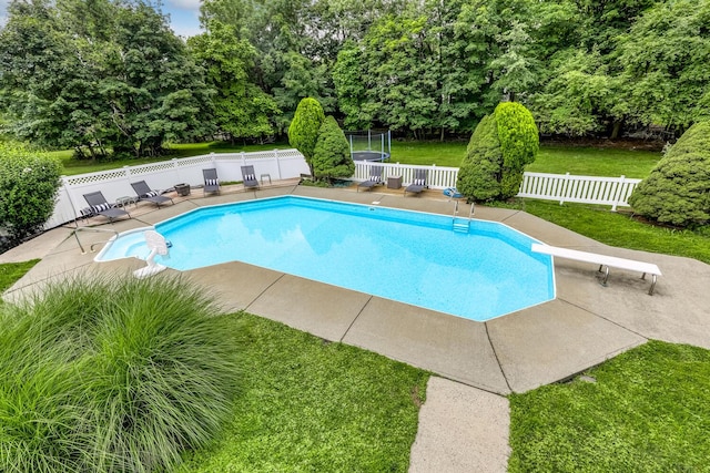 28 Lime Kiln Rd, Suffern, NY 10901 - view of pool with a diving board, a fenced backyard, a patio, and view of wooded area