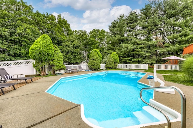 28 Lime Kiln Rd, Suffern, NY 10901 - view of swimming pool with a fenced backyard, a patio area, and view of wooded area