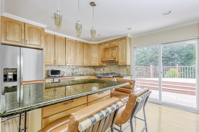 28 Lime Kiln Rd, Suffern, NY 10901 - kitchen featuring backsplash, light wood-style flooring, appliances with stainless steel finishes, a kitchen breakfast bar, and ornamental molding
