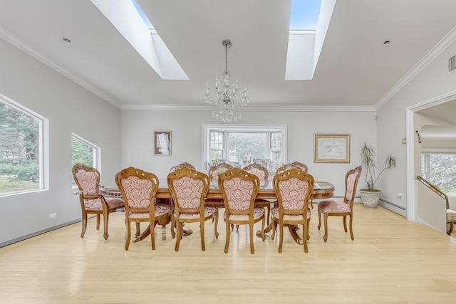 28 Lime Kiln Rd, Suffern, NY 10901 - dining room featuring a skylight, a chandelier, light wood finished floors, plenty of natural light, and crown molding
