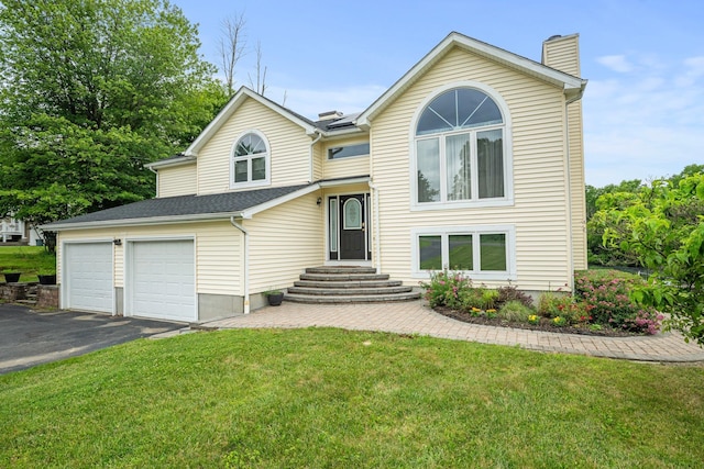 125 Whipple Rd, Middletown, NY 10940 - view of front of home with a chimney, asphalt driveway, a front lawn, and a garage