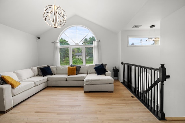 125 Whipple Rd, Middletown, NY 10940 - living room with a chandelier, vaulted ceiling, and light wood finished floors