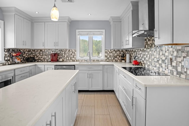 125 Whipple Rd, Middletown, NY 10940 - kitchen with wall chimney range hood, black electric stovetop, tasteful backsplash, pendant lighting, and recessed lighting