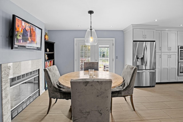 125 Whipple Rd, Middletown, NY 10940 - dining space with recessed lighting, a fireplace, and wood tiled floors