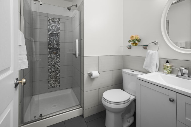 125 Whipple Rd, Middletown, NY 10940 - full bathroom featuring vanity, a stall shower, tile patterned flooring, tile walls, and a wainscoted wall