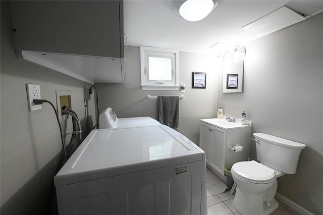 184 Sumpwams Ave, Babylon, NY 11702 - bathroom with independent washer and dryer, tile patterned flooring, and vanity