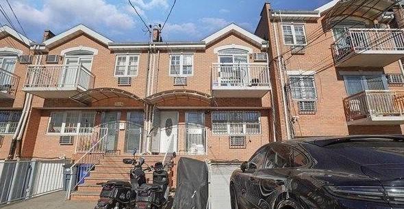 104-61 42nd Ave, Corona, NY 11368 - view of front facade with brick siding