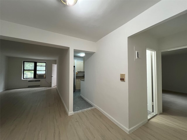 150-15 72nd Rd Unit 1A, Kew Garden Hills, NY 11367 - hallway featuring radiator, light wood-style flooring, and cooling unit