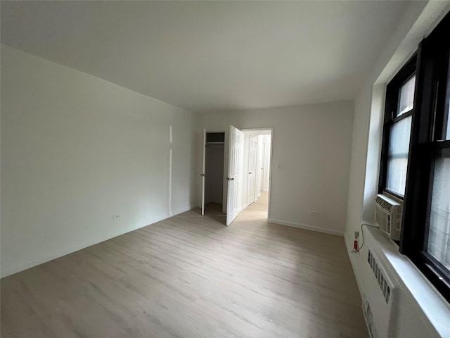 150-15 72nd Rd Unit 1A, Kew Garden Hills, NY 11367 - spare room featuring light wood-style floors and cooling unit