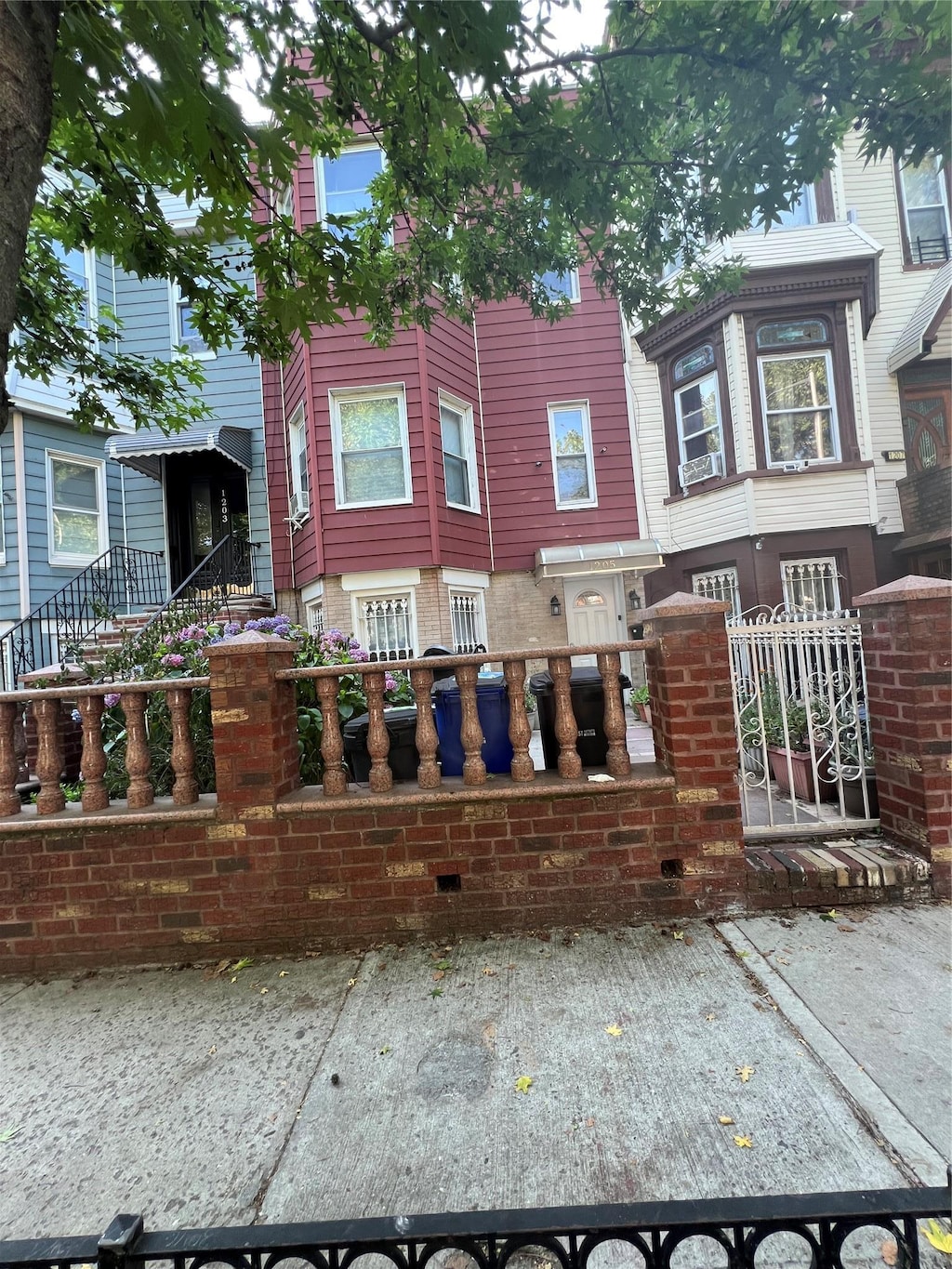 1205 Hancock St, Brooklyn, NY 11221 - townhome / multi-family property with a fenced front yard