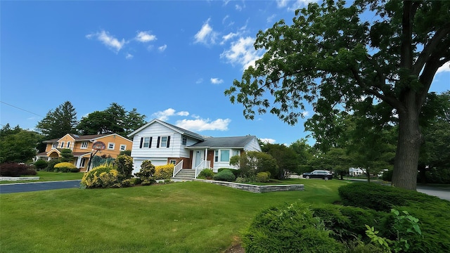 64 Meadowfarm Rd, Manhasset Hills, NY 11040 - tri-level home featuring a front yard and asphalt driveway