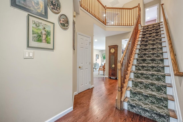 52 Mantack Path, Kings Park, NY 11754 - stairway with wood finished floors and a high ceiling