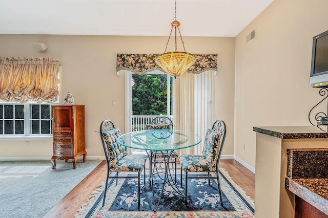 52 Mantack Path, Kings Park, NY 11754 - dining area featuring wood finished floors and a chandelier