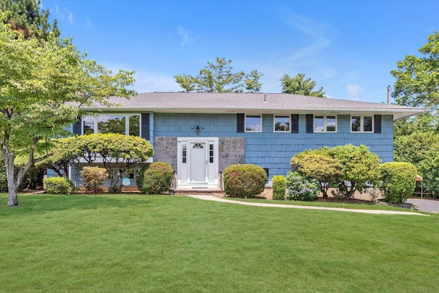 9 Bittersweet Ln, Glen Cove, NY 11542 - bi-level home featuring a front lawn and roof with shingles