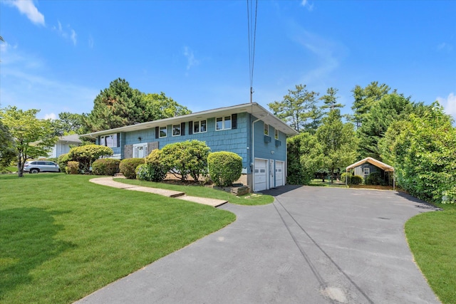 9 Bittersweet Ln, Glen Cove, NY 11542 - raised ranch featuring an attached garage, asphalt driveway, and a front lawn