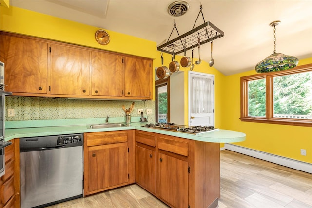 9 Bittersweet Ln, Glen Cove, NY 11542 - kitchen featuring stainless steel dishwasher, a peninsula, light countertops, gas stovetop, and a baseboard radiator