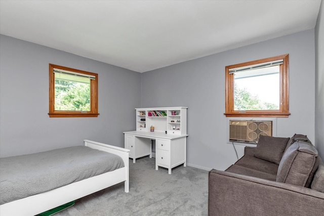 9 Bittersweet Ln, Glen Cove, NY 11542 - bedroom with light colored carpet and a wall unit AC