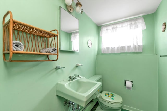 9 Bittersweet Ln, Glen Cove, NY 11542 - half bathroom with toilet and a sink