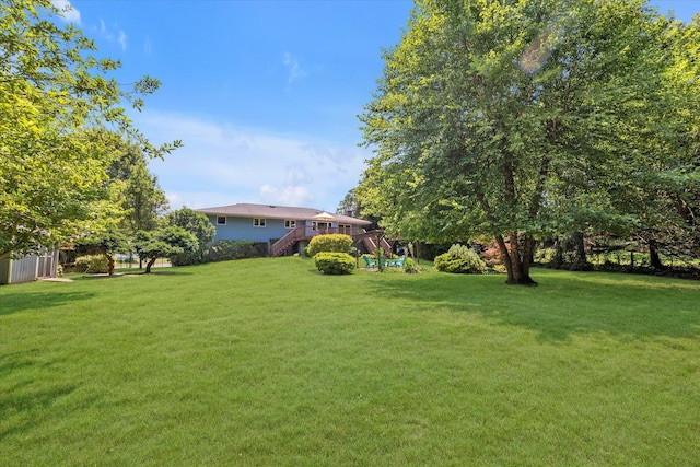 9 Bittersweet Ln, Glen Cove, NY 11542 - view of grassy yard with stairway and a wooden deck